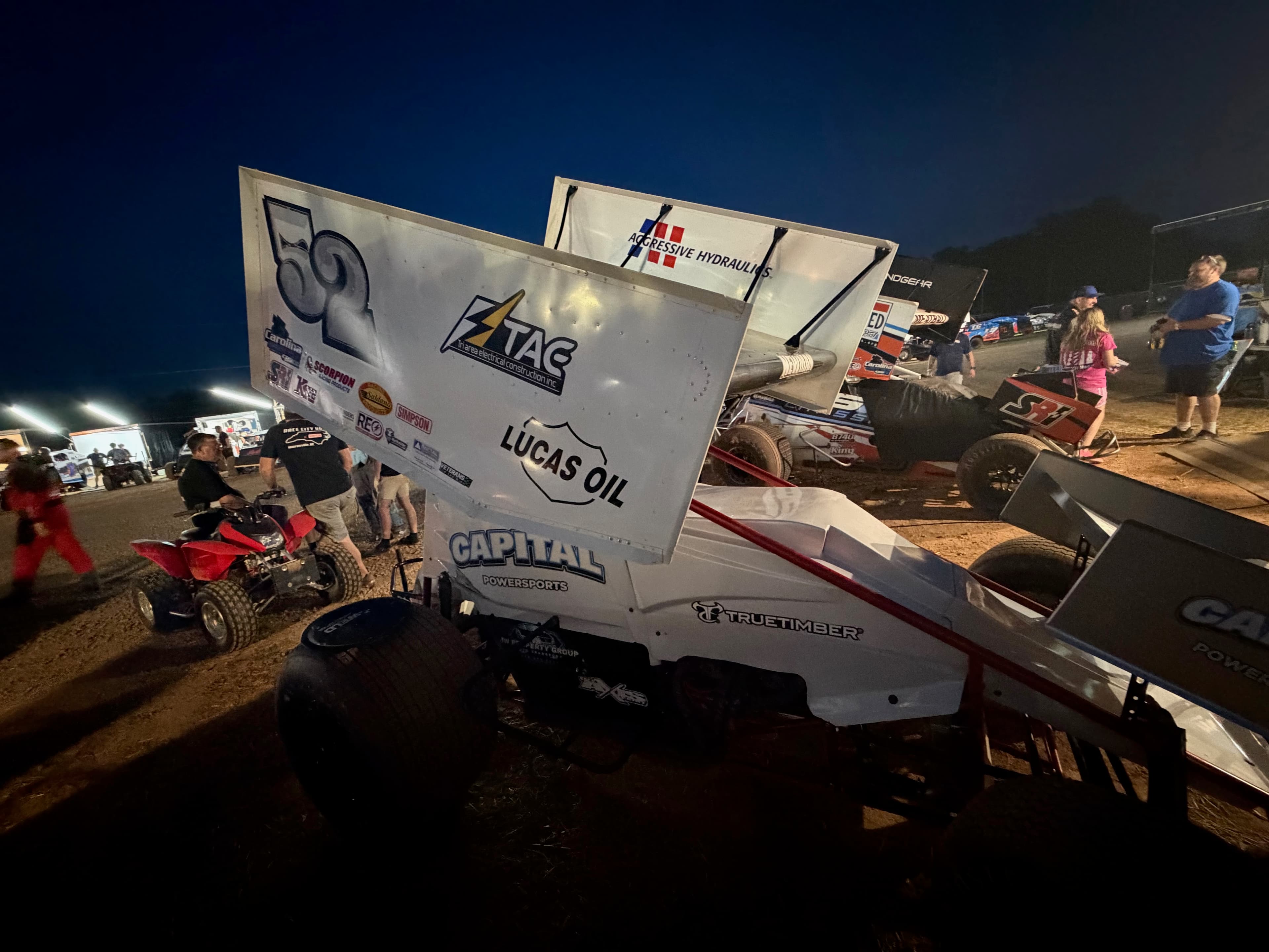 Tri-Area Electric sponsored #52 sprint car at the track at night