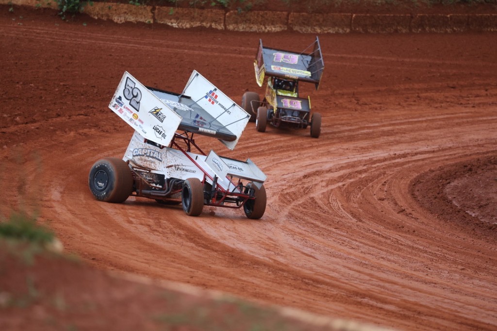 Tri-Area Electric sponsored #52 sprint car on dirt track